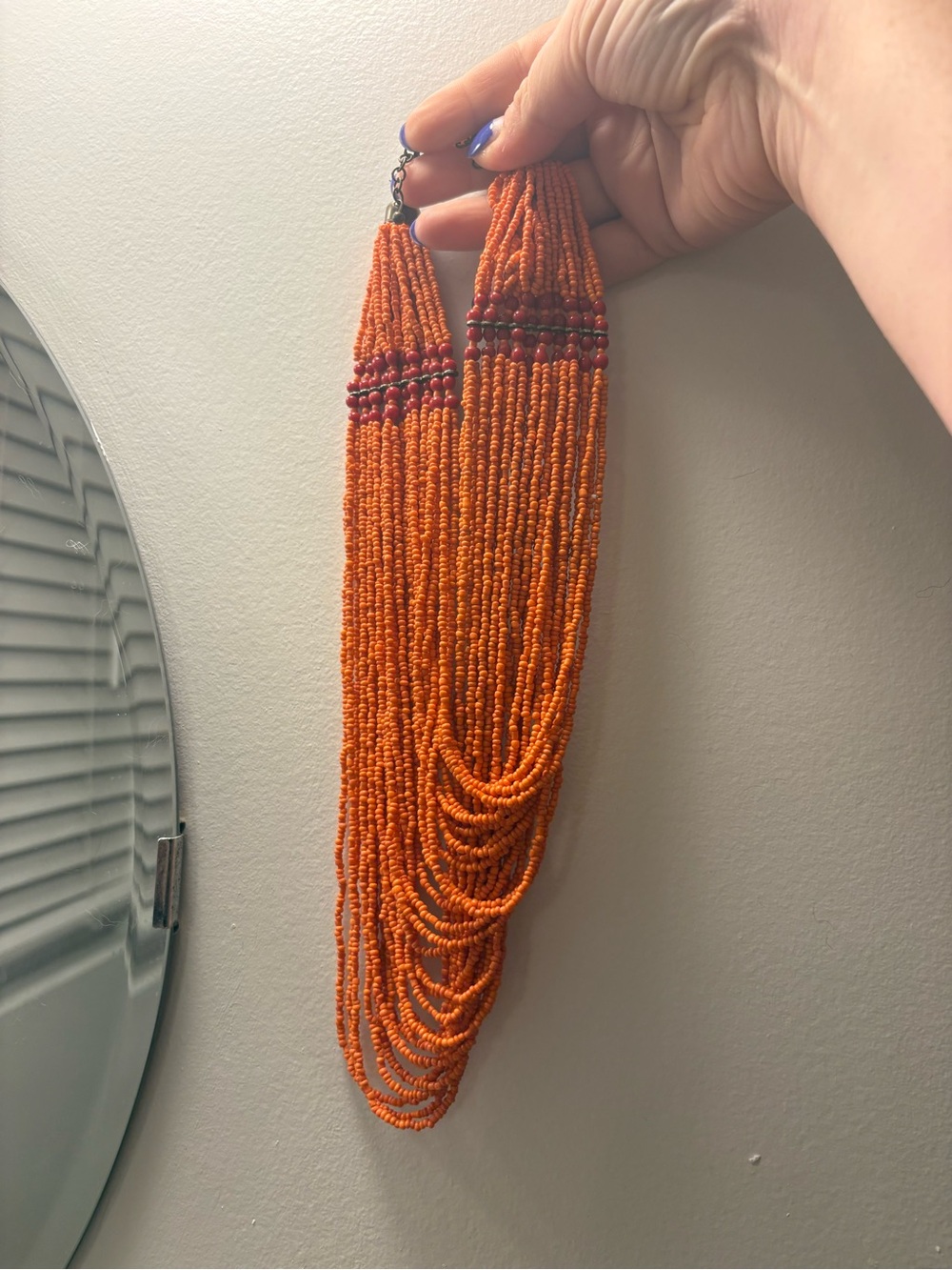 Multi-Strand Orange Beaded Necklace with Accent Detail